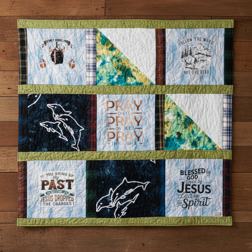 Quilt with various printed fabric squares featuring text and graphics on a dark background
