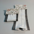 Set of fabric swatches with floral patterns on a dark background